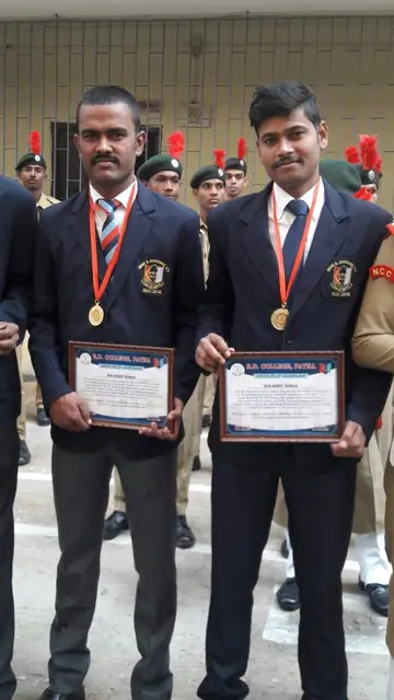 Students with medals and certificates