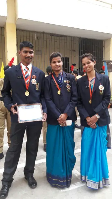 Students with medals and certificates